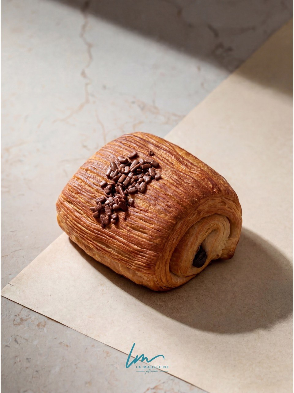 Pain au chocolat topped with chocolate sprinkles